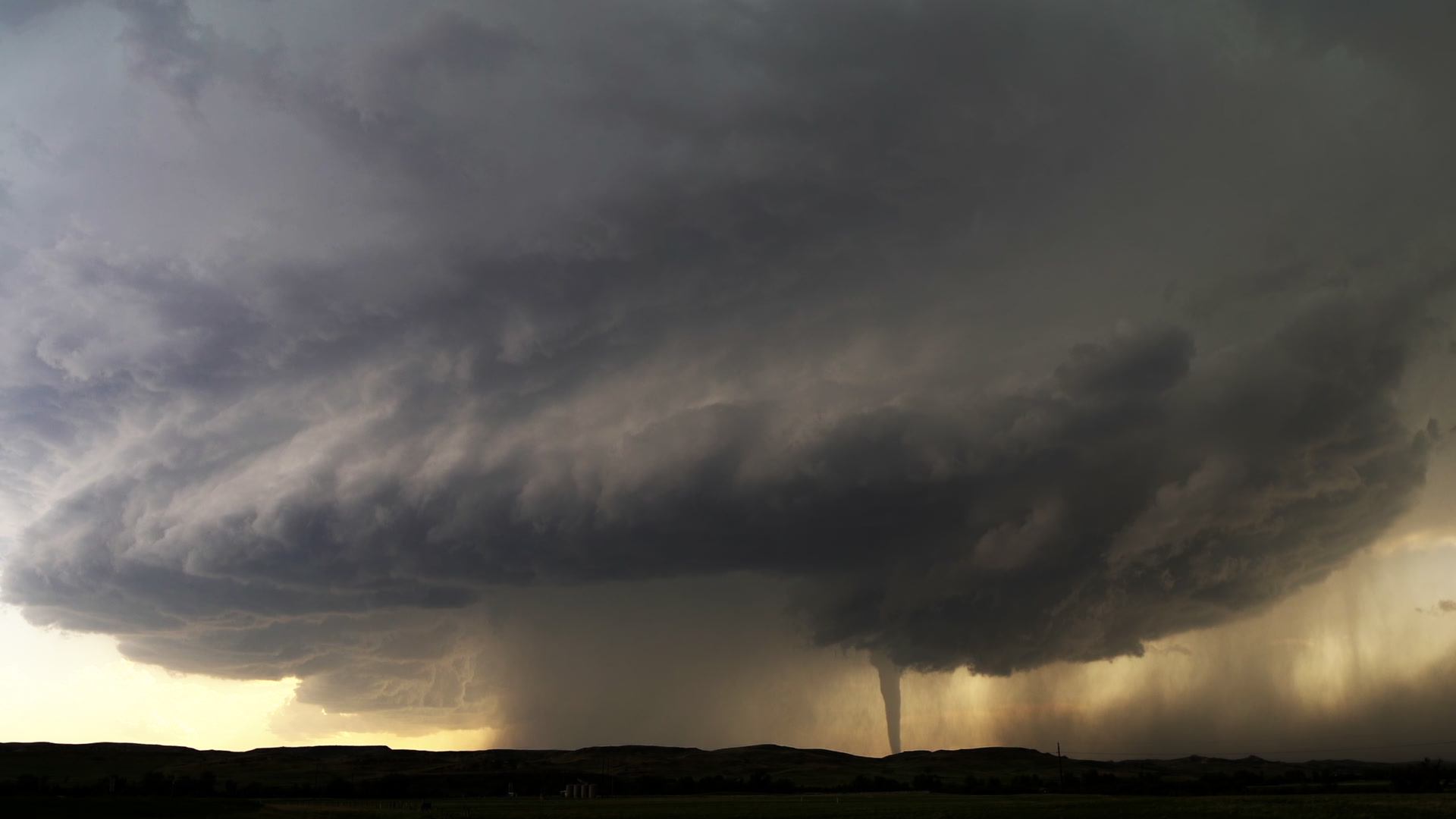 Dramatic Tornado - Tornado tracks beneath large supercell thunderstorm. North Dakota, 4K.
