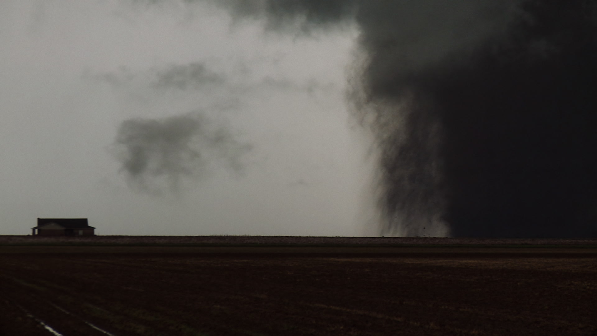 Oklahoma Tornado - Big wedge tornado, lightning strike, house. Cinematographer: Martin Lisius. Need more? Give us a shout!