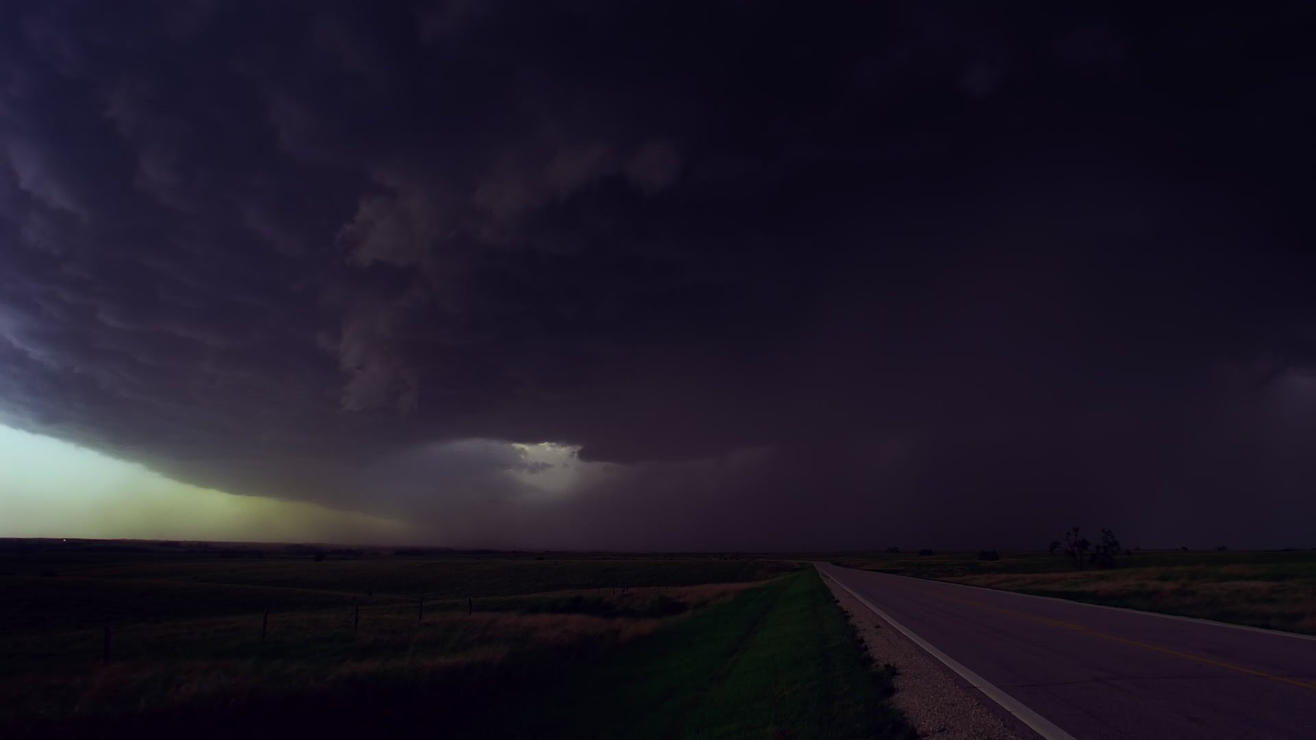 Storms on 35 - Lightning bolts strike the ground as cars escape massive supercell thunderstorm, Salina, Kansas. Super 35mm film to 4K video. Cinematographer: Martin Lisius. Need more? Give us a shout!