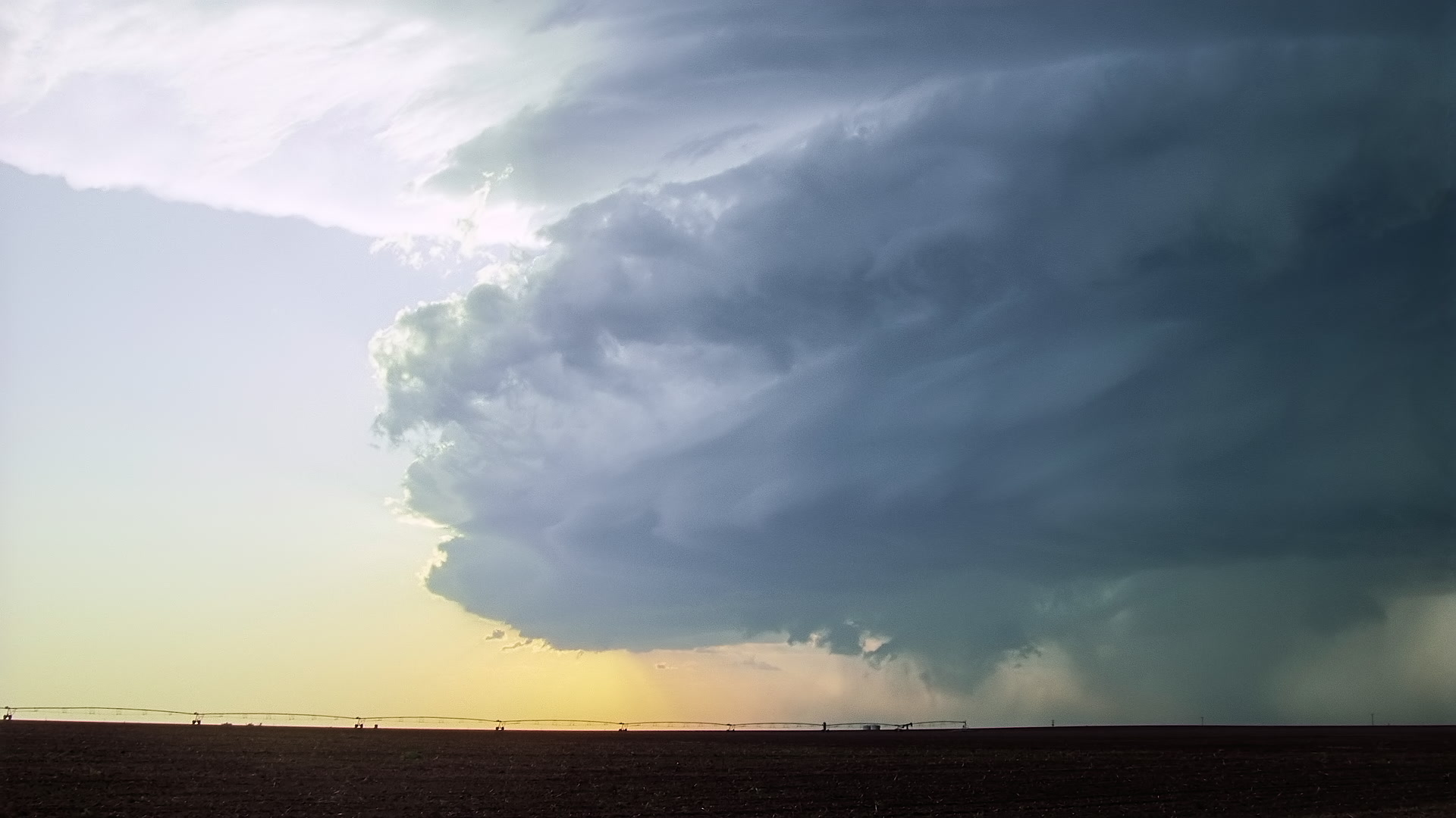 Storms on 35 - Mothership supercell thunderstorm approaches, sunset, Texas. Super 35mm film to 4K video. Cinematographer: Martin Lisius. Need more? Give us a shout!