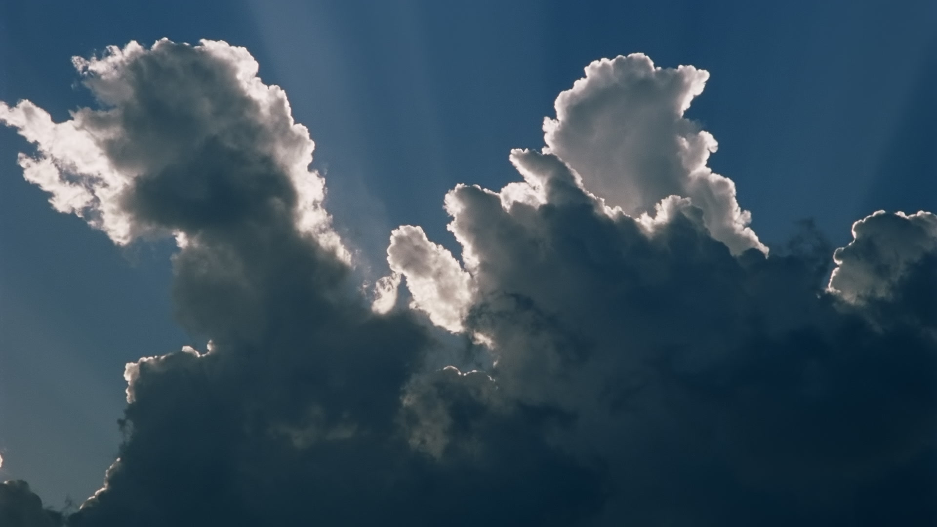 Storms on 35 - Storm grows in sun, blue sky. Super 35mm film to 4K video. Cinematographer: Martin Lisius. Need more? Give us a shout!