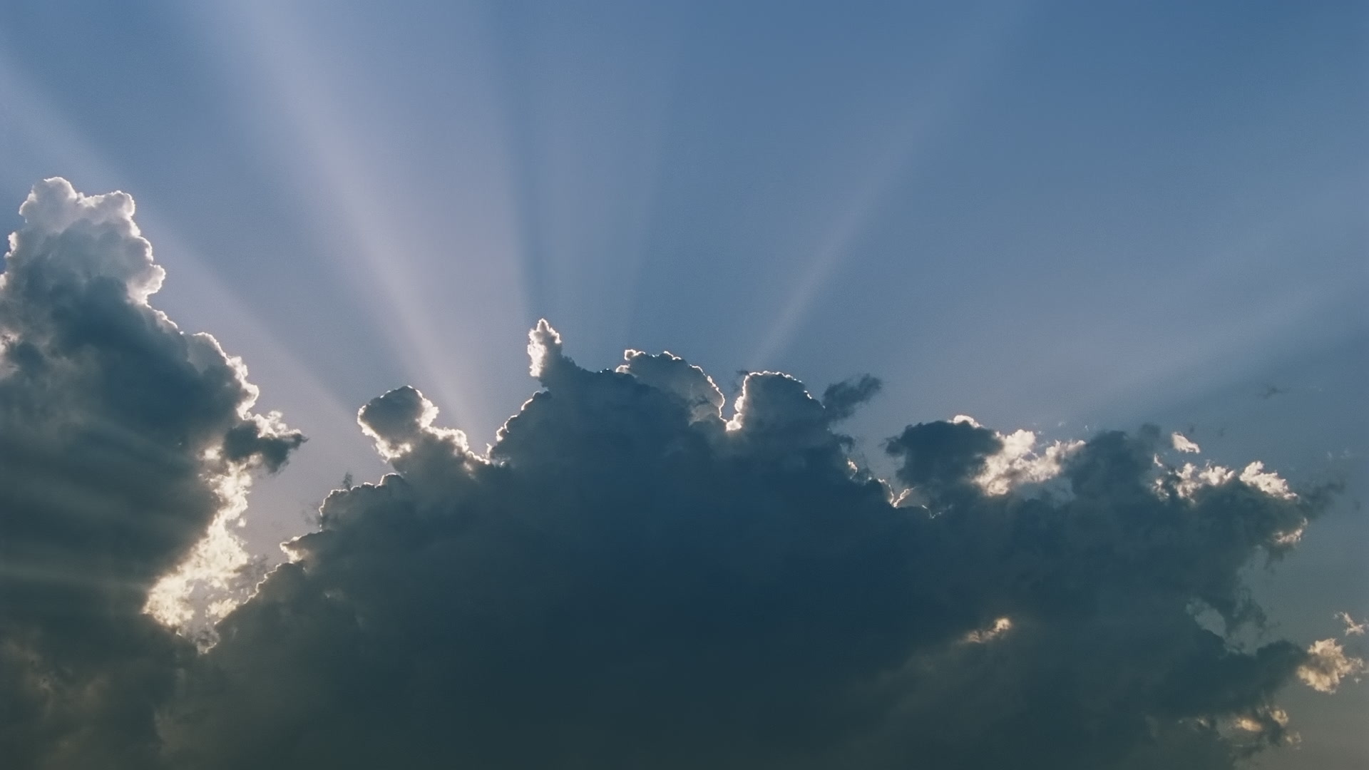 Storms on 35 - Sunrays shine above developing storm. Super 35mm film to 4K video. Cinematographer: Martin Lisius. Need more? Give us a shout!