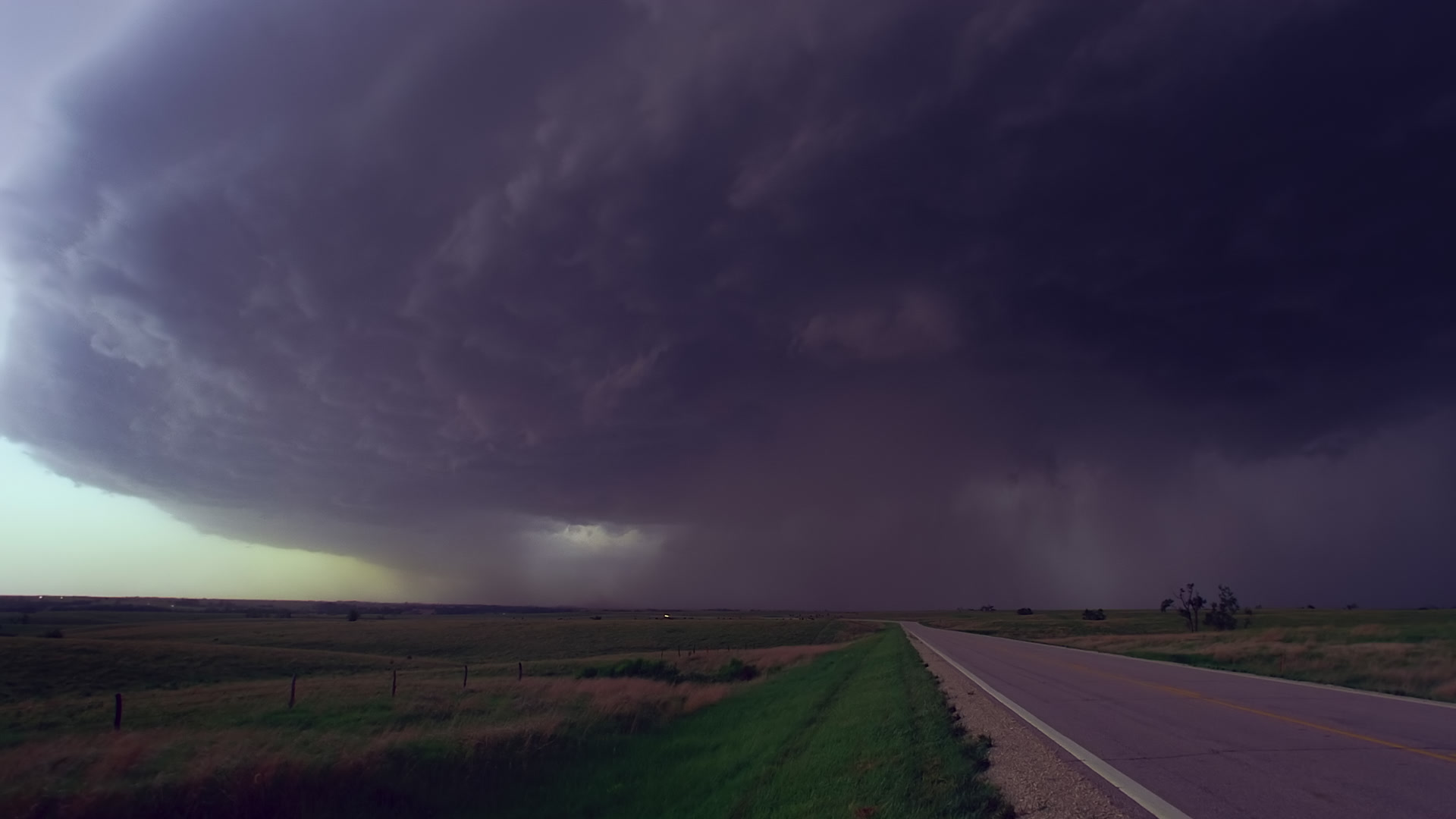 Storms on 35 - Cars escape approaching monster supercell thunderstorm, Salina, Kansas. Super 35mm film to 4K video. Cinematographer: Martin Lisius. Need more? Give us a shout!