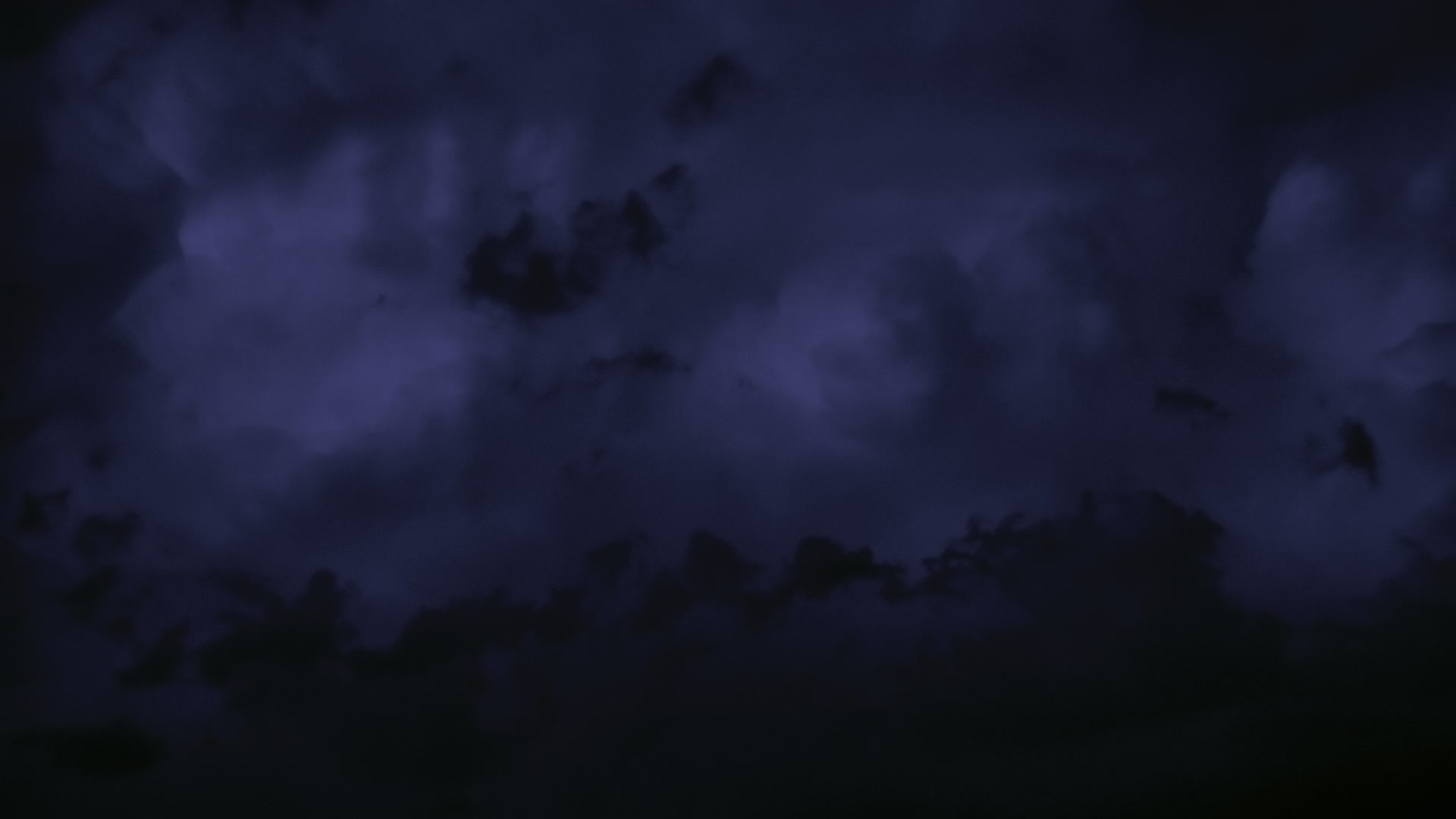 Storms on 35 - Lightning flashes inside blue thunderstorm, dusk, El Reno. Super 35mm film to 4K video. Cinematographer: Martin Lisius. Need more? Give us a shout!