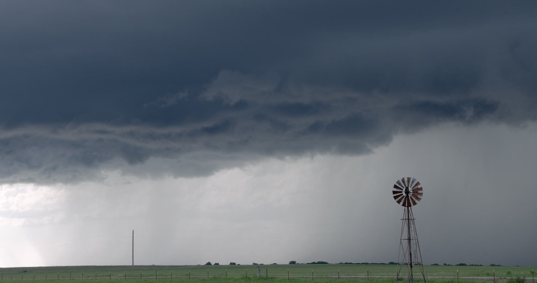 Storm clouds drift over spinning windmill, DCI 4K. Cinematographer: Martin Lisius.