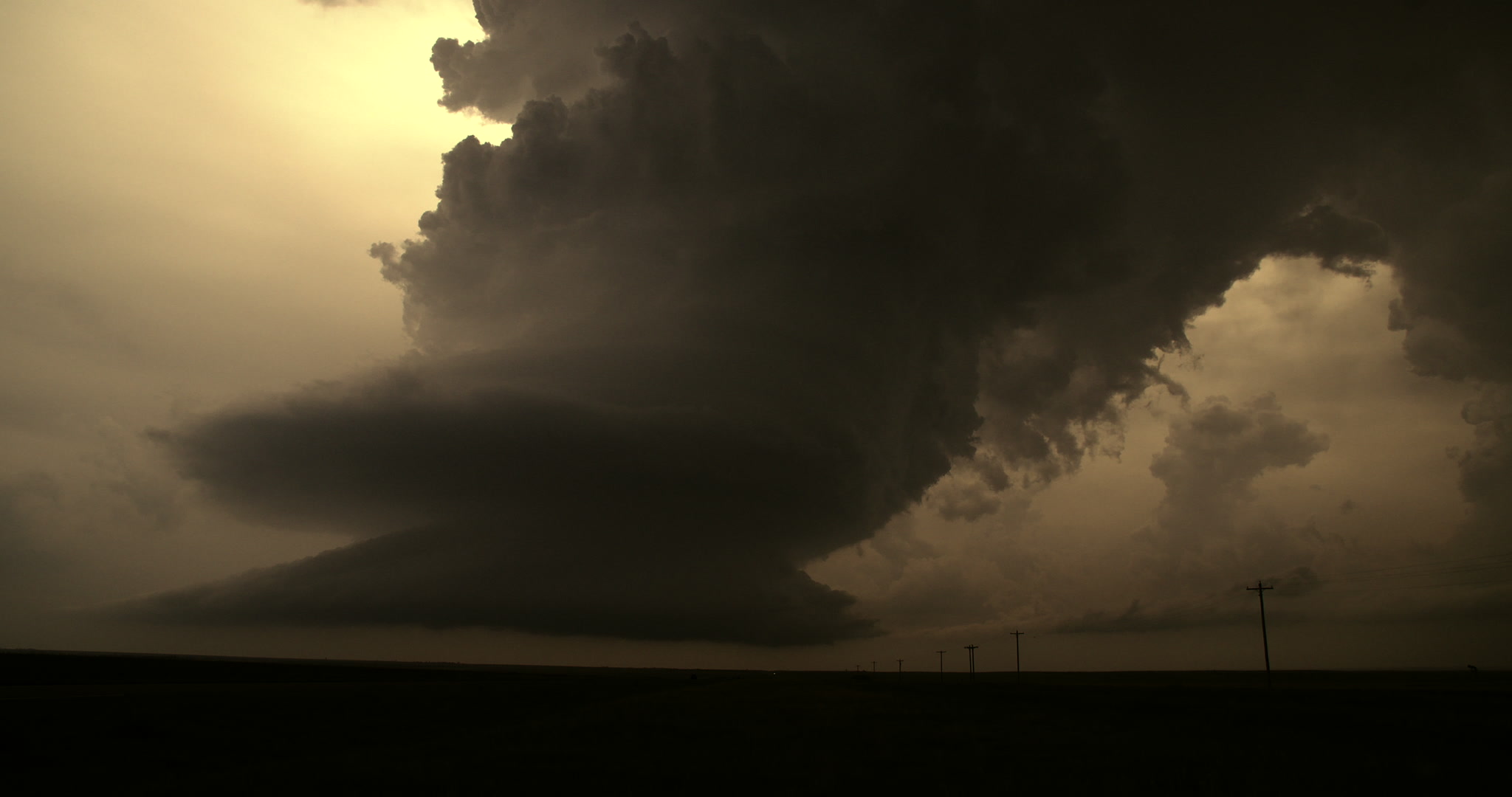 Storm clouds - Supercell thunderstorm spins toward camera, golden light, 4K. Cinematographer: Martin Lisius. DCI 4K. Need more storm shots? Contact us.
