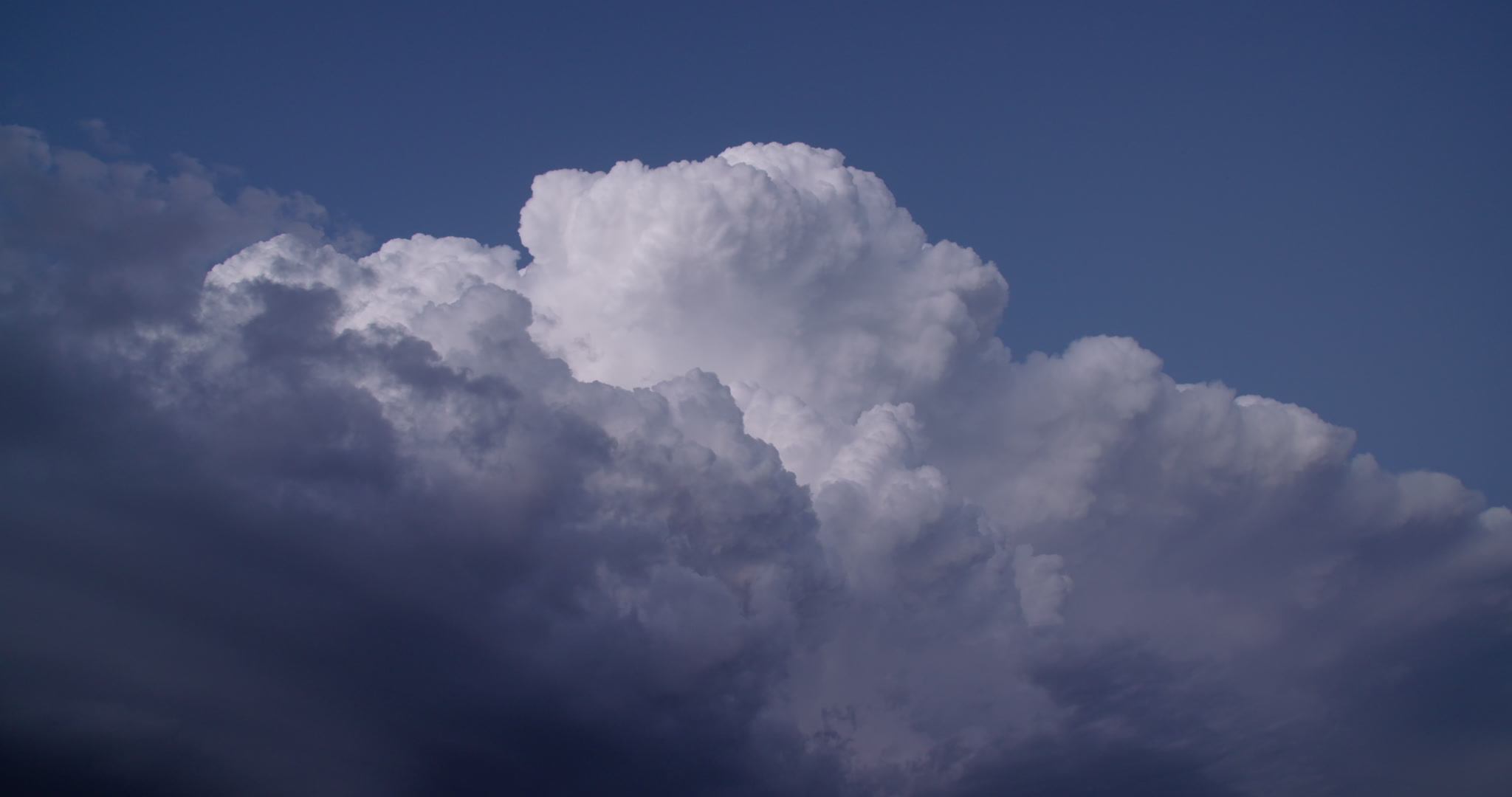 4K Storm Clouds - Storm with lightning drifts slowly at dusk. Cinematographer: Martin Lisius.
