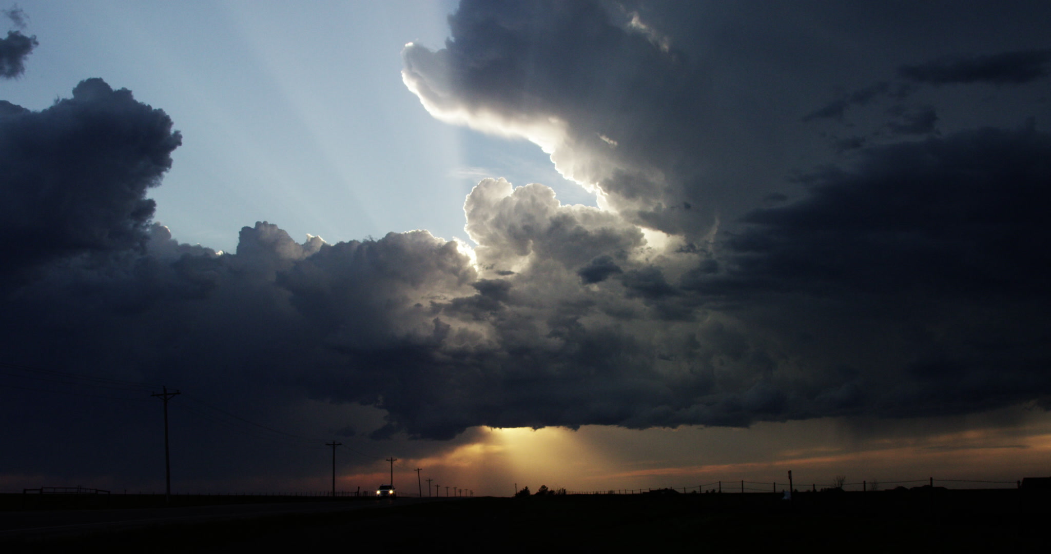 Storm clouds - storm develops over highway, early evening, 4K. Cinematographer: Martin Lisius. DCI 4K. Need more storm shots? Contact us.