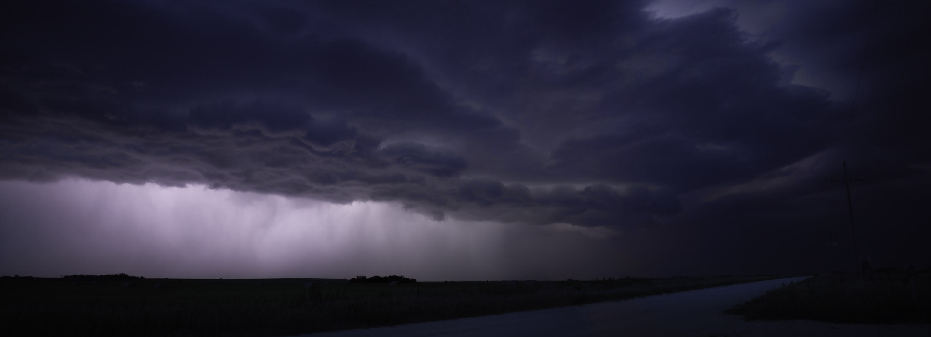 16K video - Thunderstorm moves across rural road at night, time-lapse. Cinematographer: Martin Lisius. Need more 16K footage? Contact us.