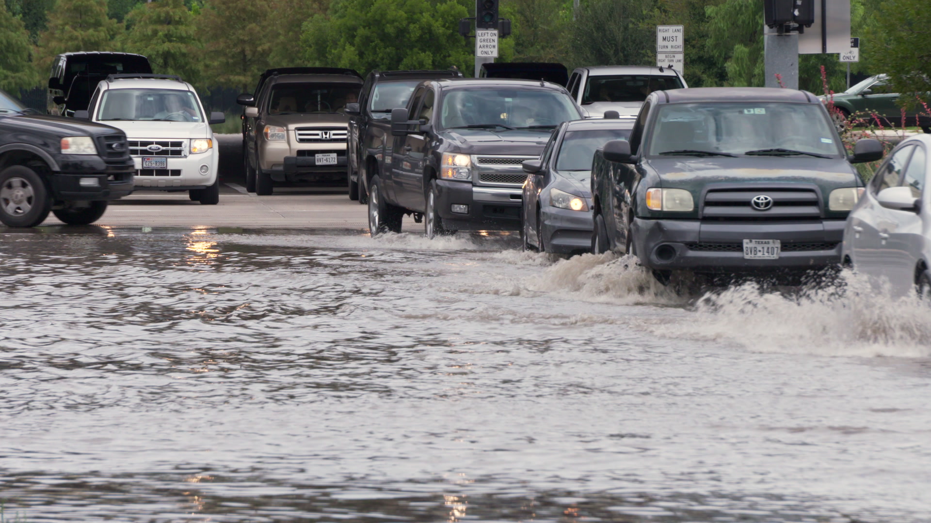 Hurricane Harvey - Traffic drives across flooded road, 4K. Contact us to see more Hurricane Harvey footage.