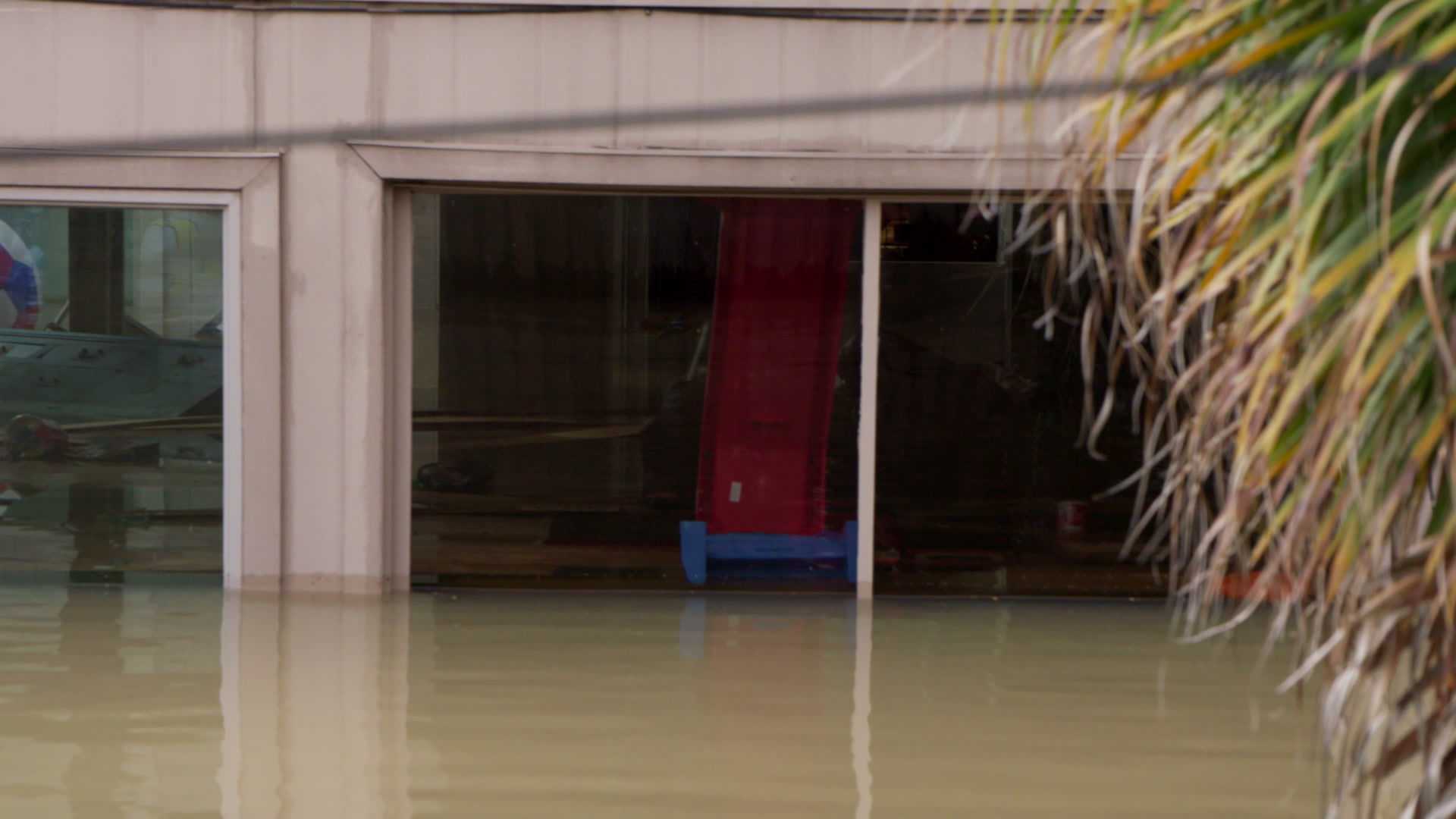 Close-up of flooded home, boat POV, Hurricane Harvey, Texas, 4K. Cinematographer: Martin Lisius.