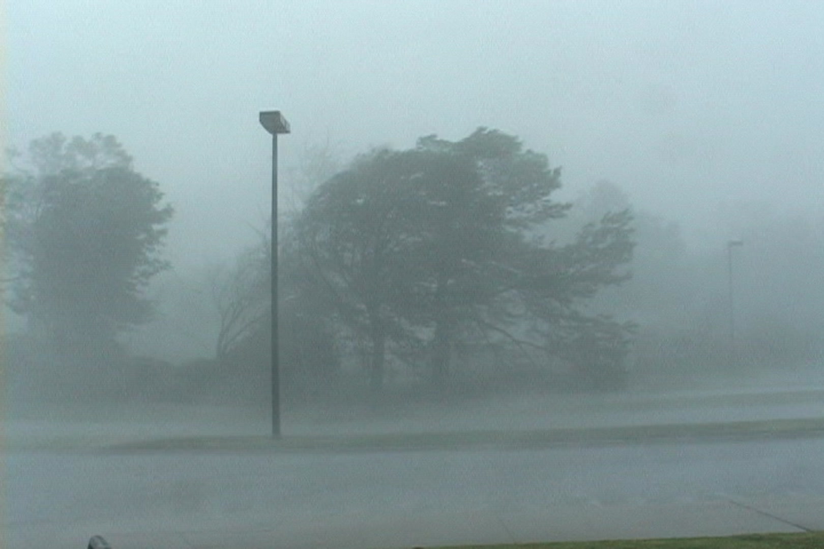 Intense wind and rain blow down street just as Katrina comes onshore.