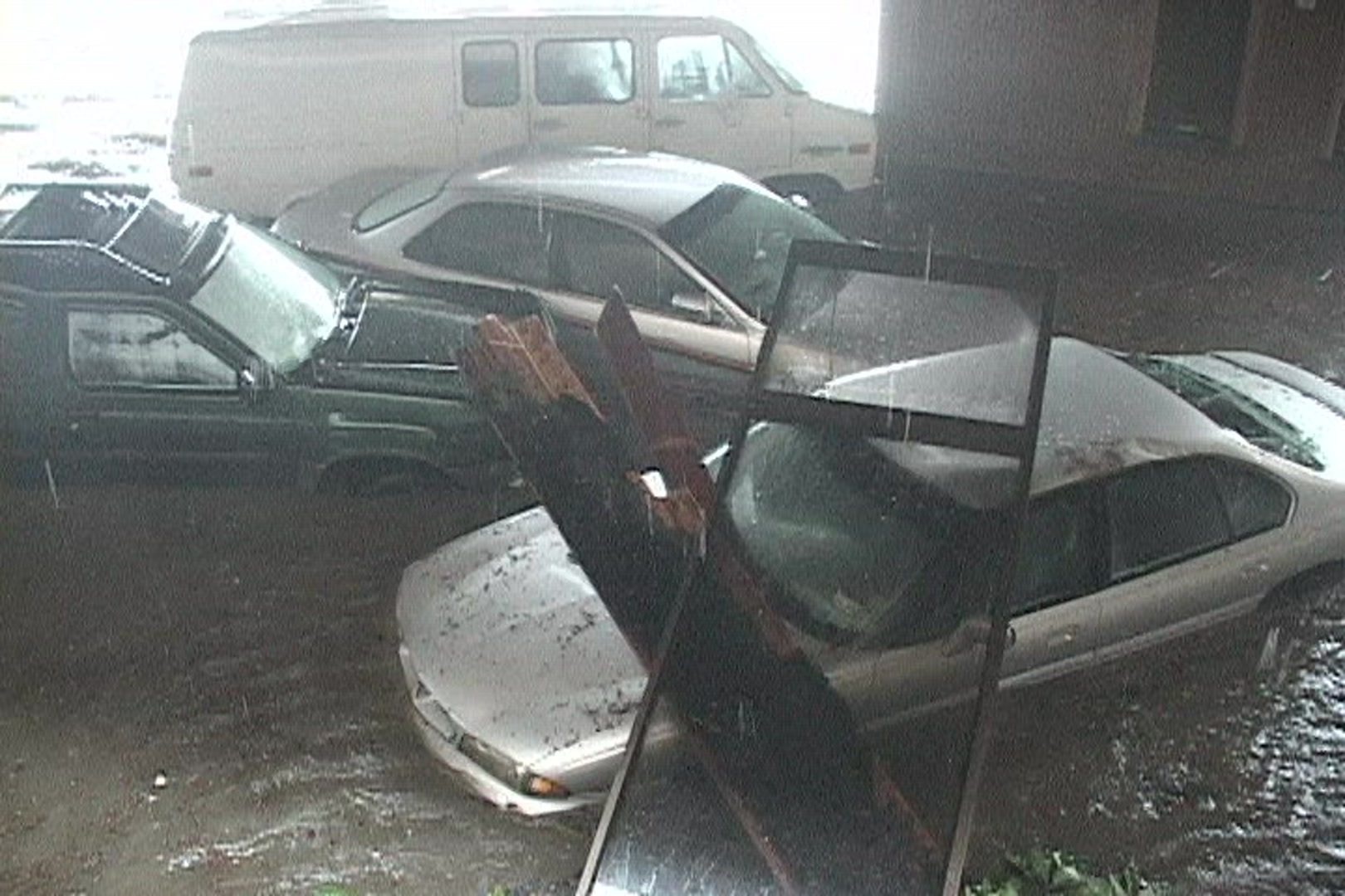 Cars piled up by storm surge, Hurricane Katrina.