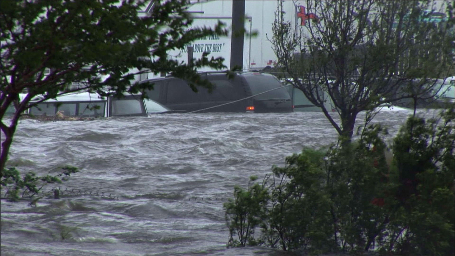Cars, flooded parking lot, storm surge, Hurricane Katrina, 4K video. Cinematographer: Martin Lisius.
