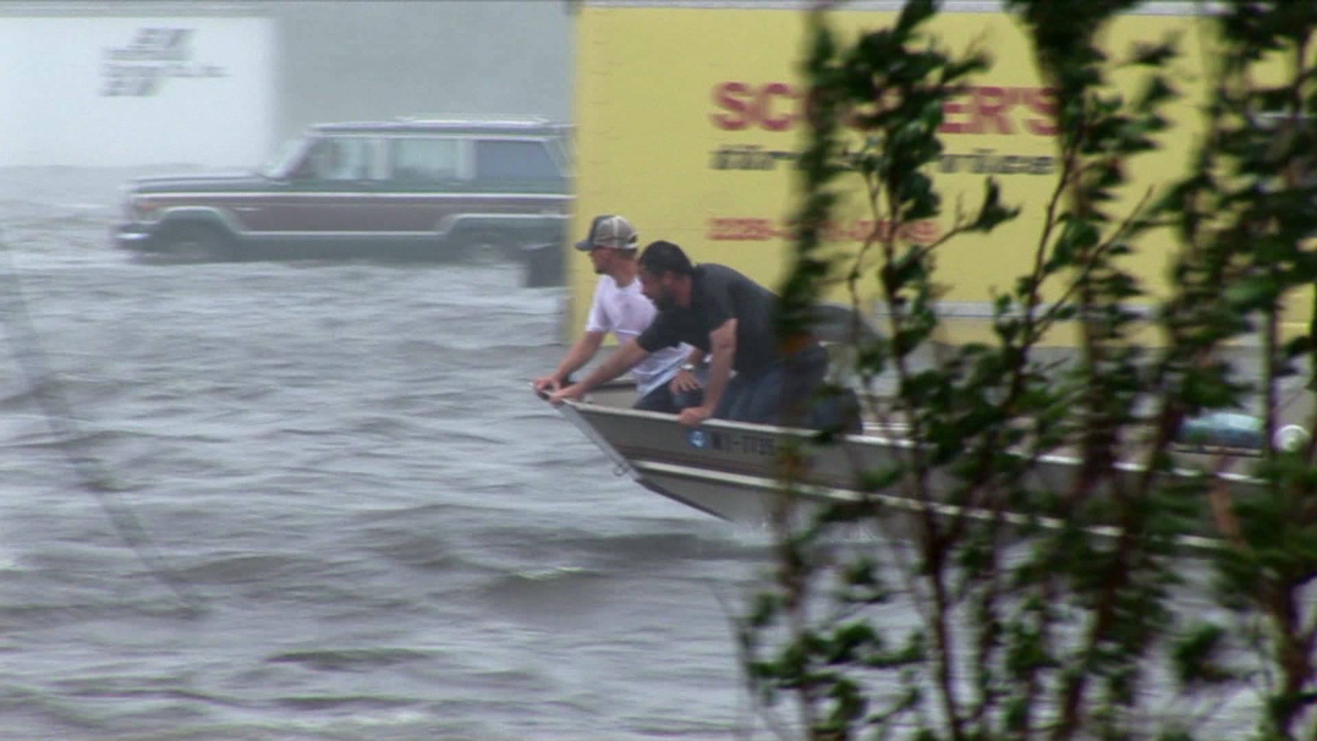 Residents search for flood victims from boat, Hurricane Katrina, 4K video. Cinematographer: Martin Lisius.