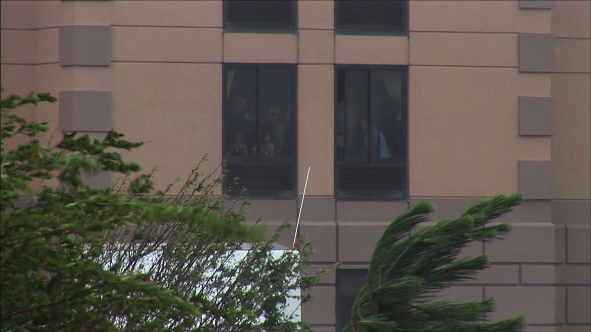People trapped in hotel look down on flooded cars, Hurricane Katrina, 4K video. Cinematographer: Martin Lisius.