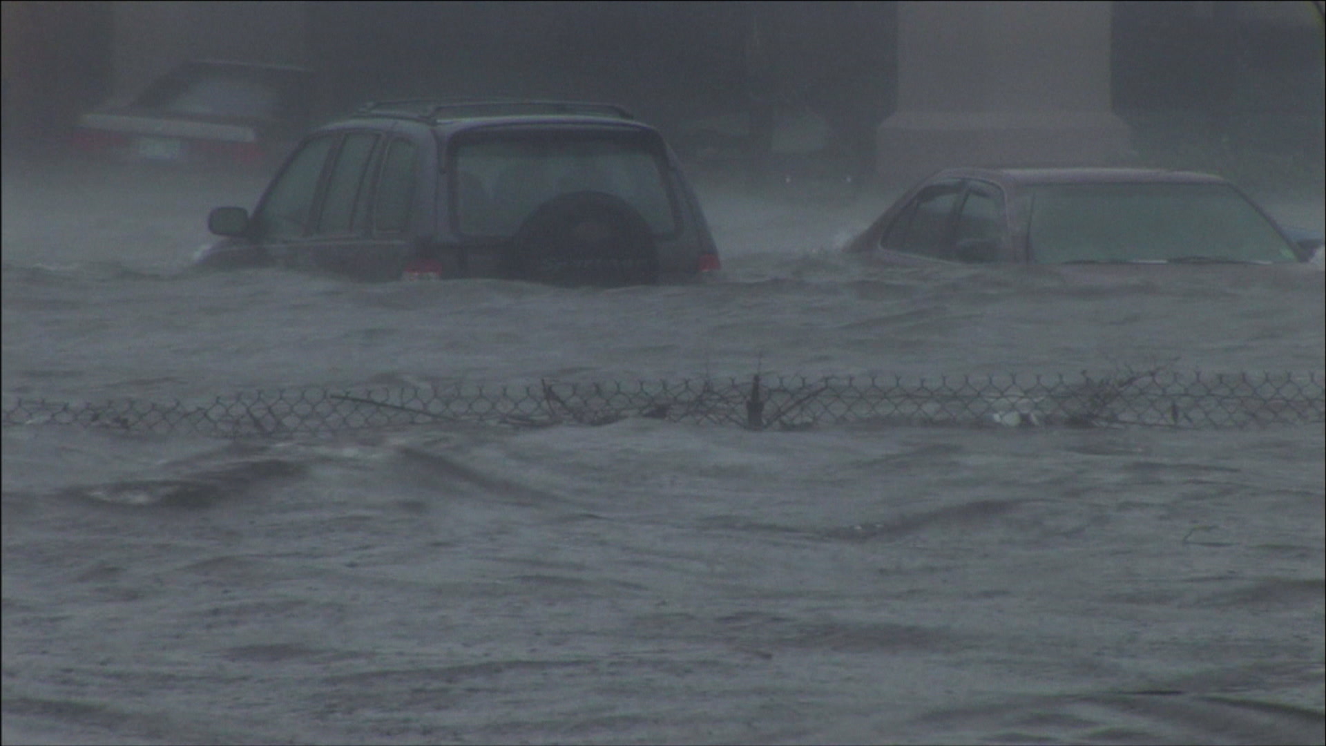Two cars caught in record storm surge, Hurricane Katrina, 4K video. Cinematographer: Martin Lisius.