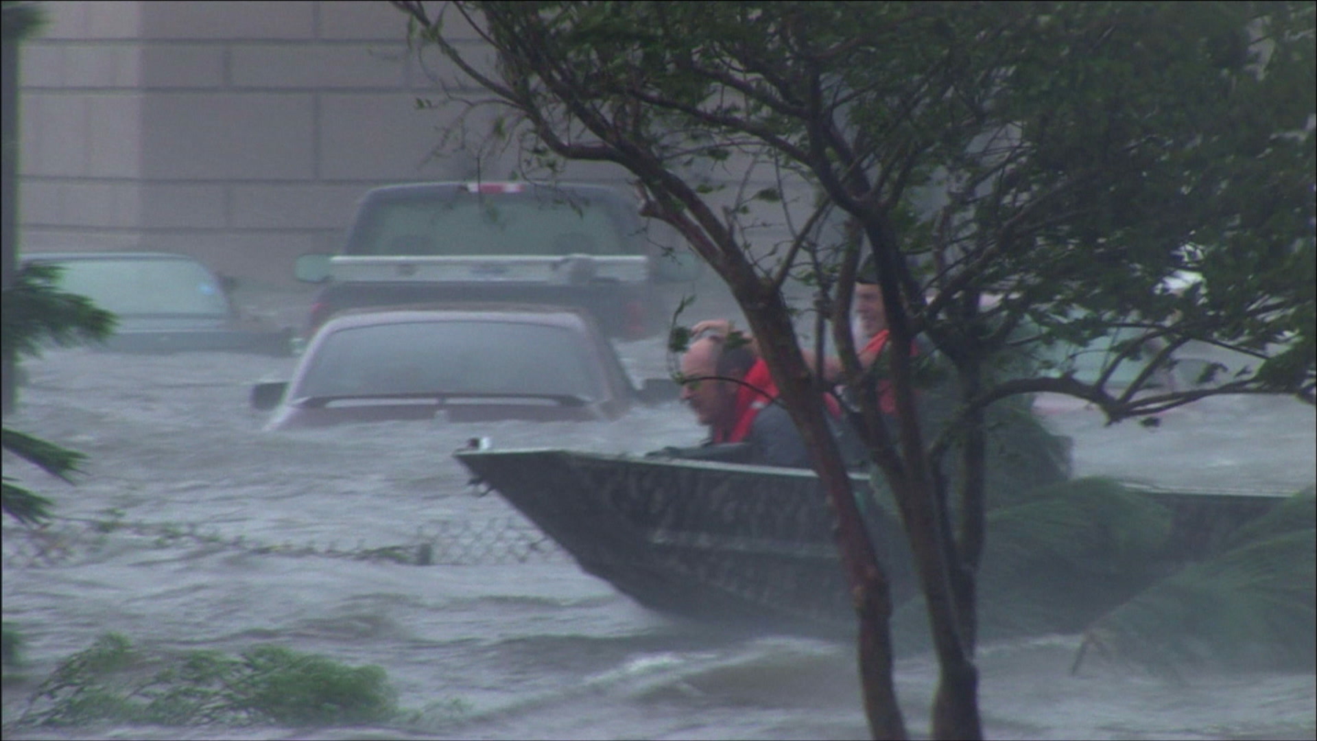 Rescue team in boat searches for victims in record storm surge, Hurricane Katrina, 4K. Cinematographer: Martin Lisius.