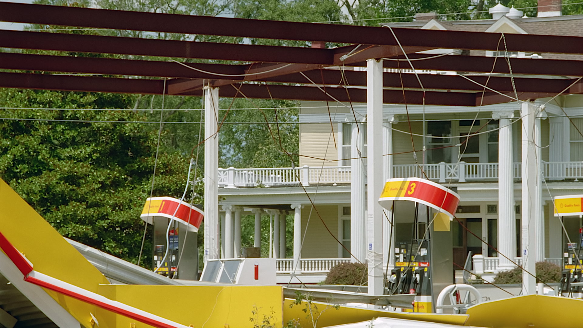 Gas station and house, Hurricane Katrina aftermath, 35mm film to 4K video. Cinematographer: Martin Lisius.