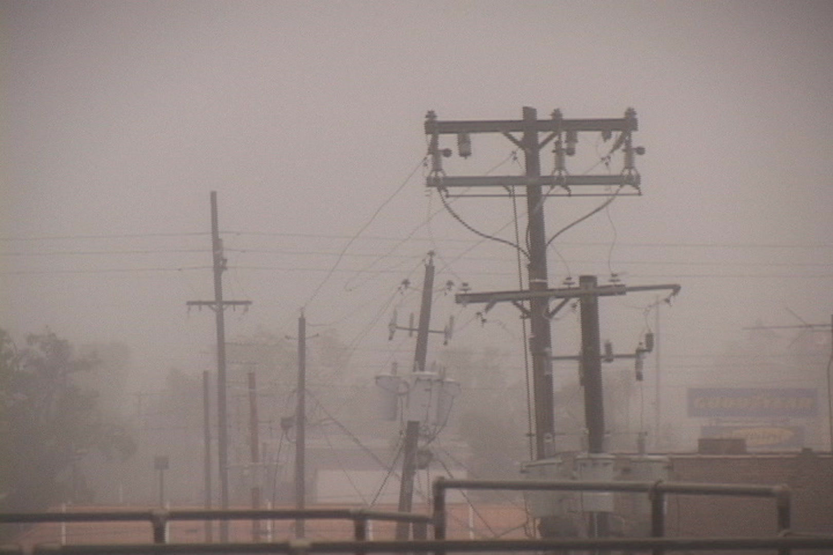 Utility pole sways, intense wind, rain, Hurricane Katrina.