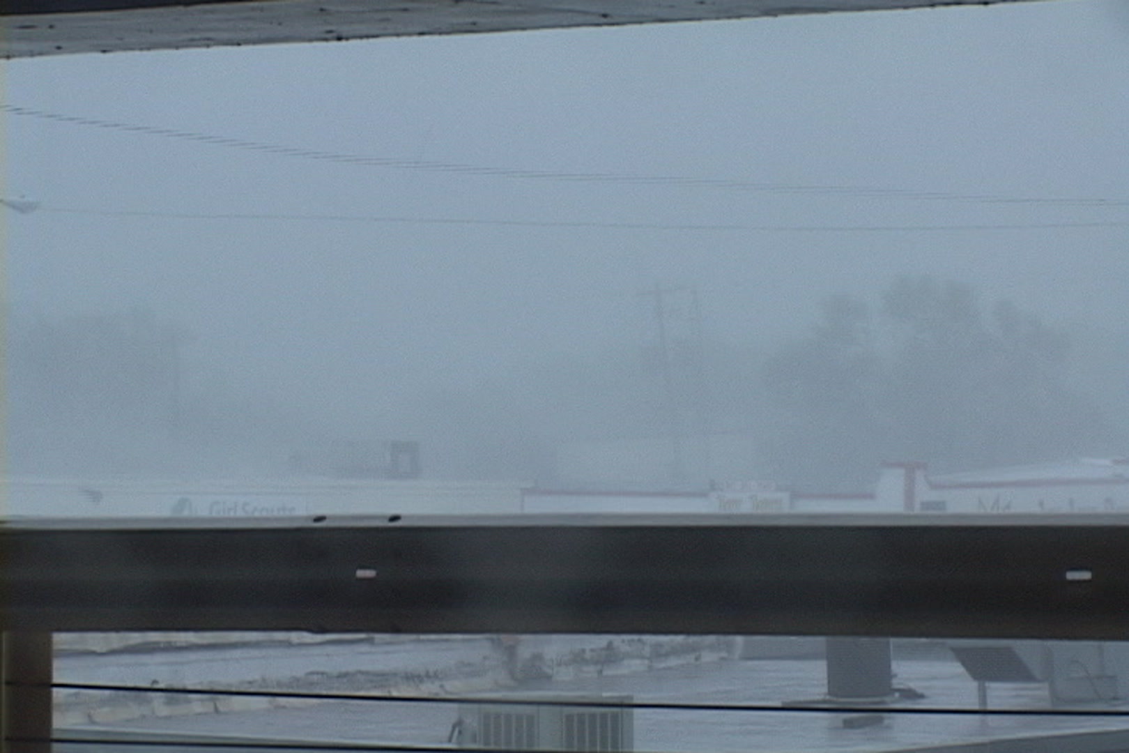 Roof explodes into air, intense wind, rain, Hurricane Katrina.