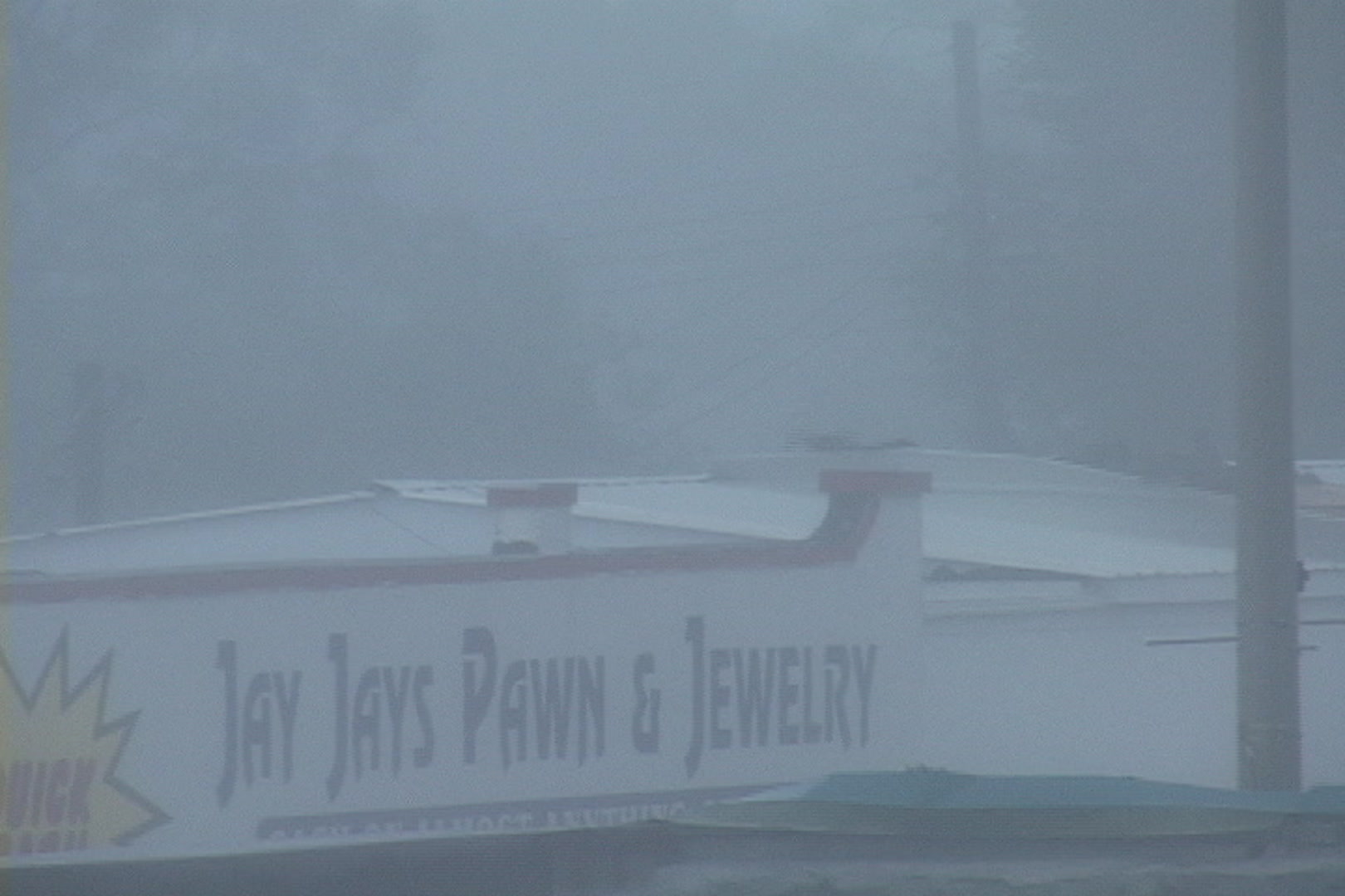 Very dramatic, unique shot of roof ripping off, Hurricane Katrina.