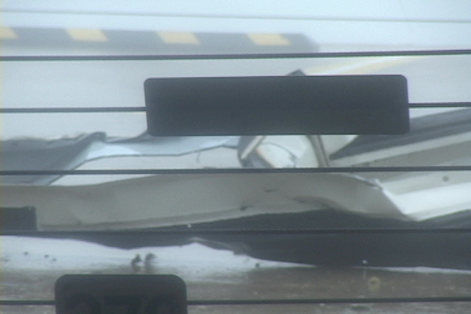 Sheet metal blows by during Hurricane Katrina.