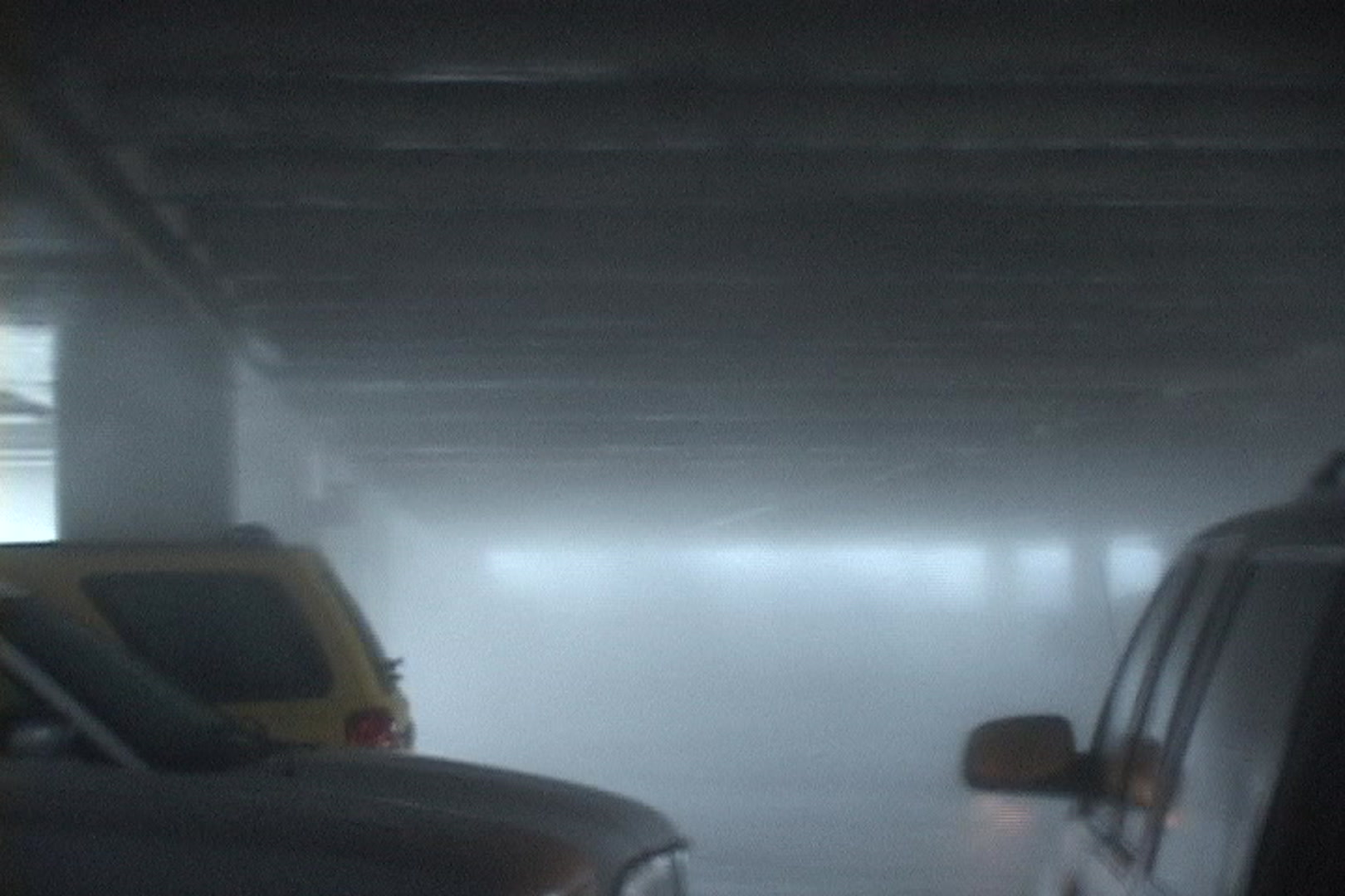 Intense wind and rain blast through parking garage during Hurricane Katrina.