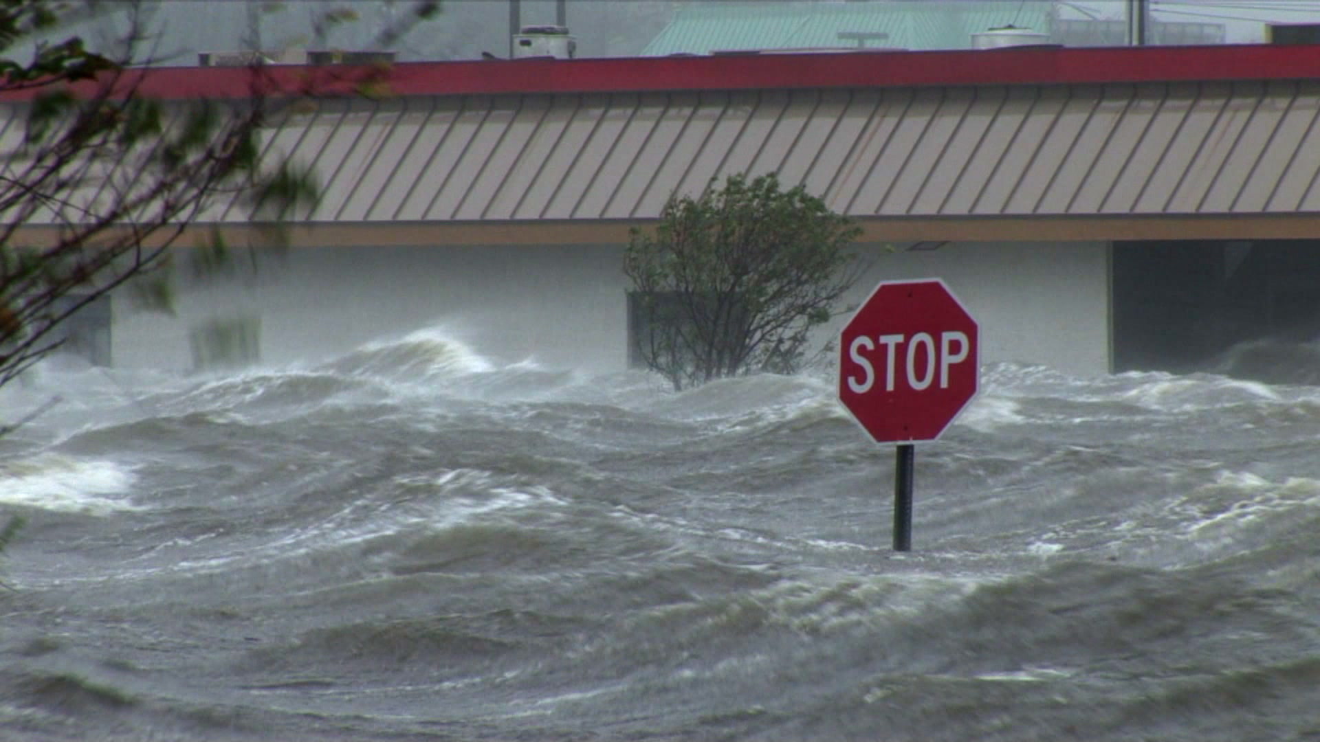 Record storm surge pounds against building, past stop sign, Hurricane Katrina, 4K.  Cinematographer: Martin Lisius.

Looking for something else? Contact us at info@stormstock.com