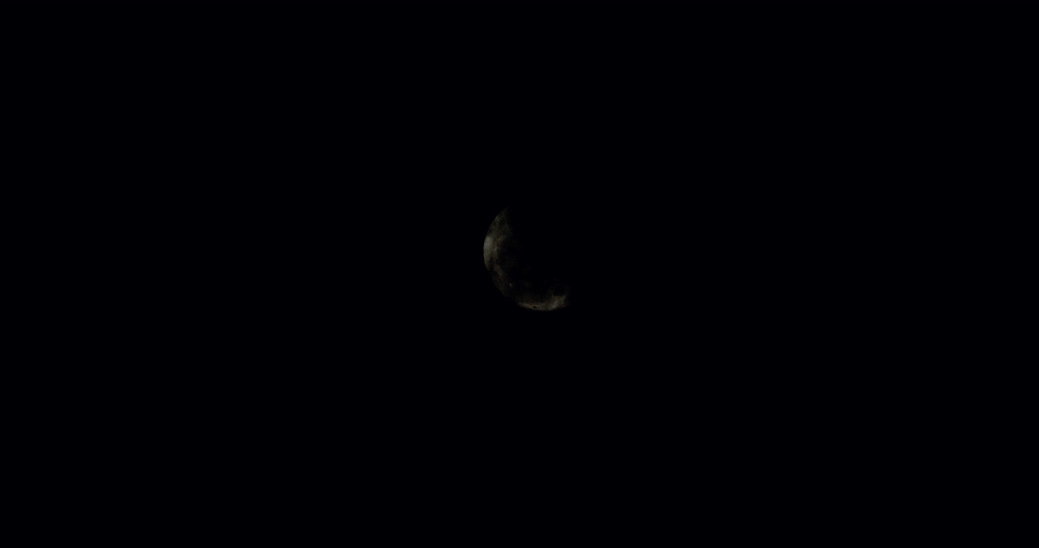Dark storm clouds cover full moon, real-time, 4K. Cinematographer: Martin Lisius. Camera: RED DSMC Dragon 5K.
