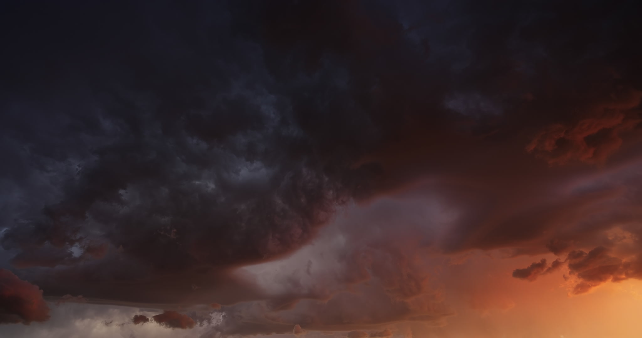 Slow time-lapse, stormy orange and teal sky. DCI 4K.