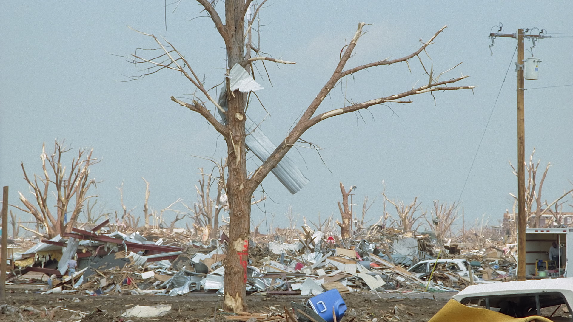 Tornado damage and aftermath - sheet metal in tree and total destruction, Greensburg EF5 aftermath, 35mm film to 4K.