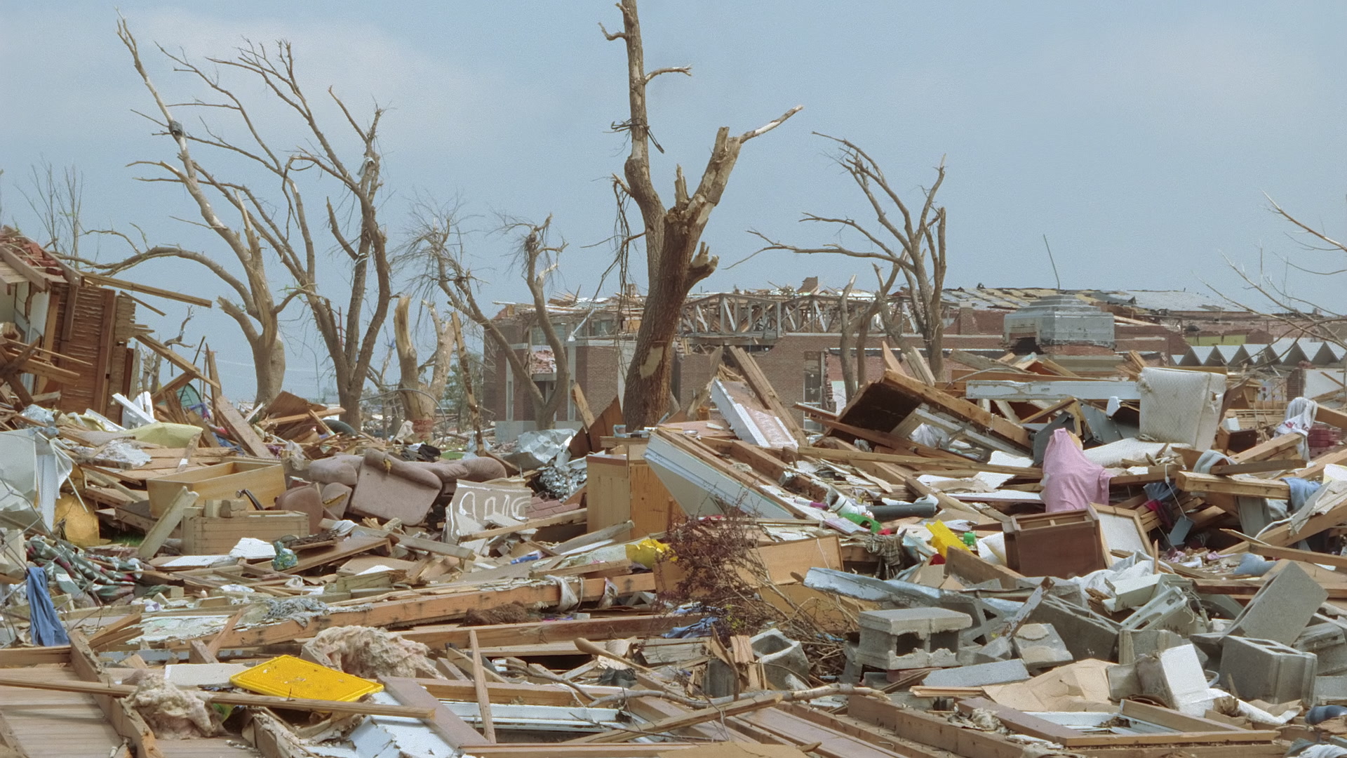 Tornado damage and aftermath - pan right, close-up of debris, Greensburg EF5 aftermath, 35mm film to 4K.