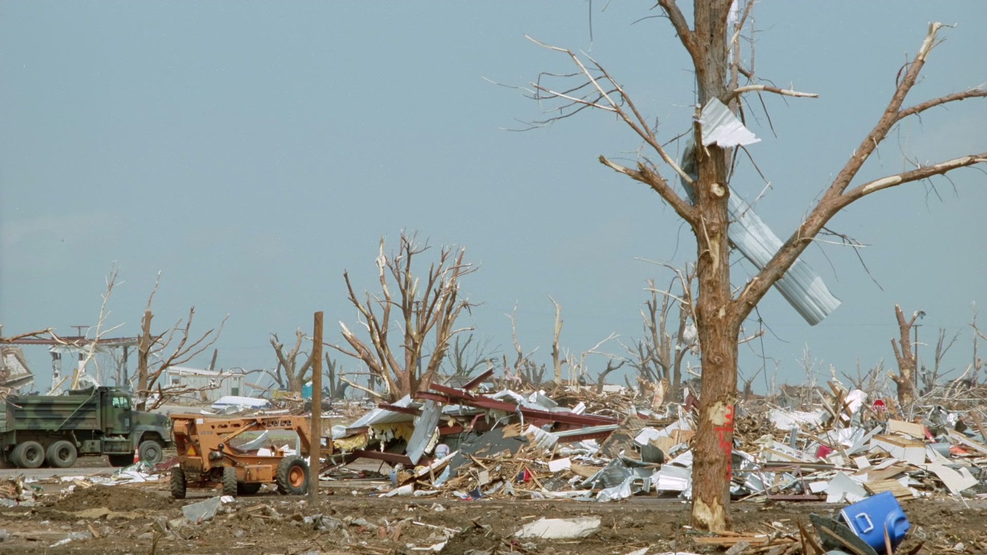 Tornado damage and aftermath - debris and stripped trees, Greensburg EF5 aftermath, 35mm film to 4K.