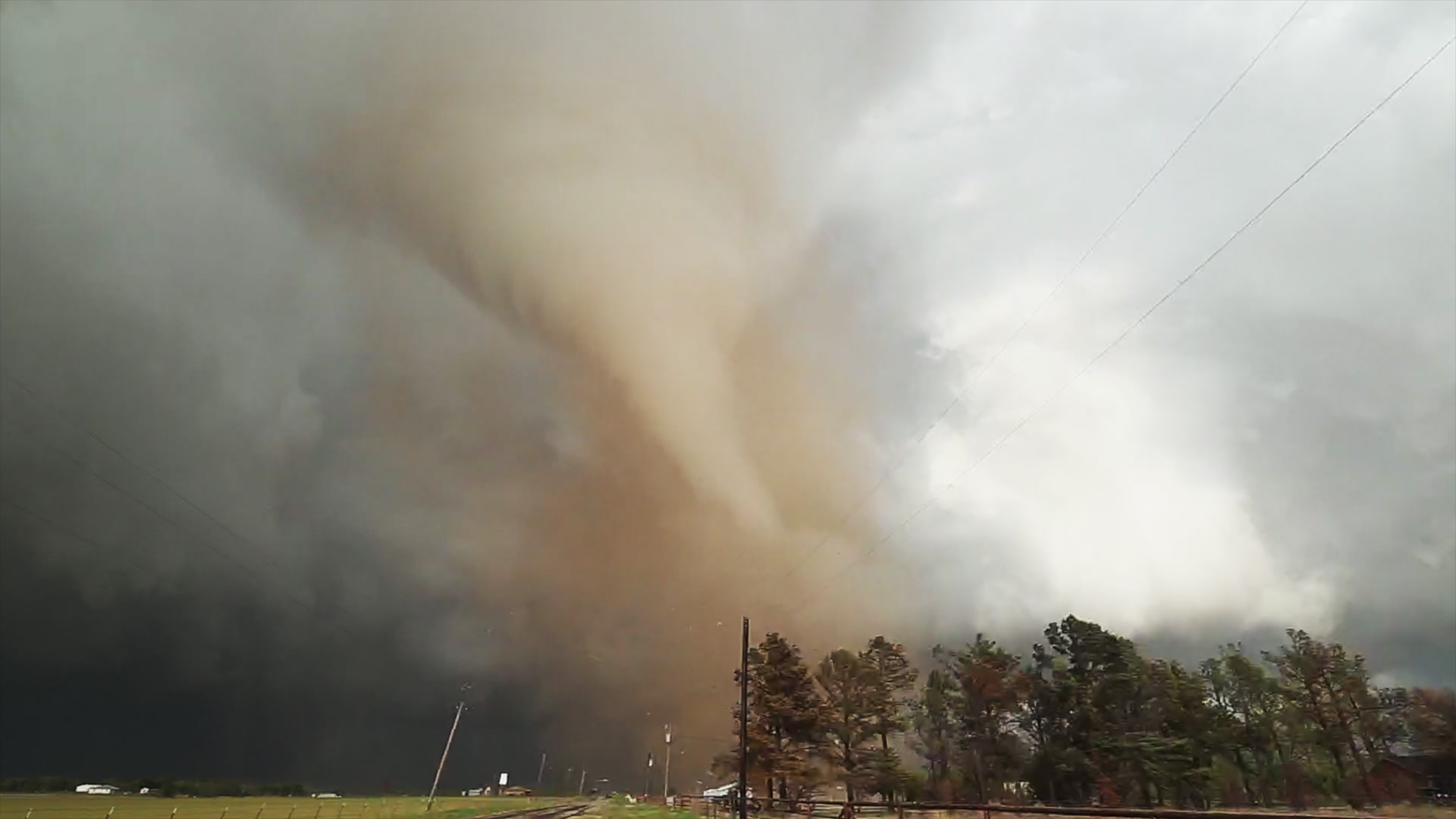 Red tornado and storm chaser, rural highway, Lockett, Texas, 4K.