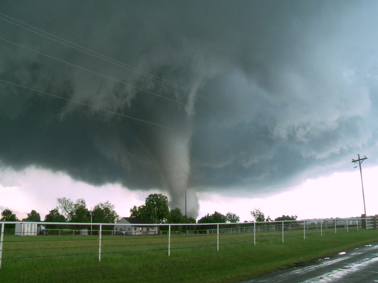 Amazing tornado passes behind house, rural Oklahoma.