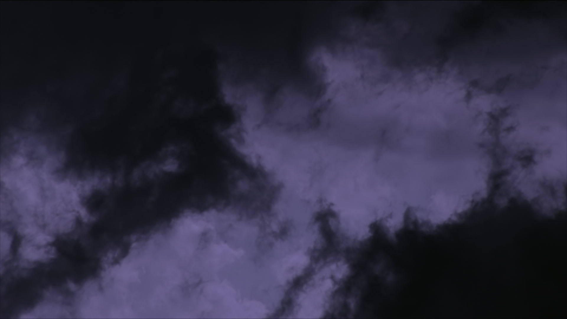 Inky black storm clouds swirl, forked lightning bolts flash, night - Super 35mm film to HD 1080. Sky only.