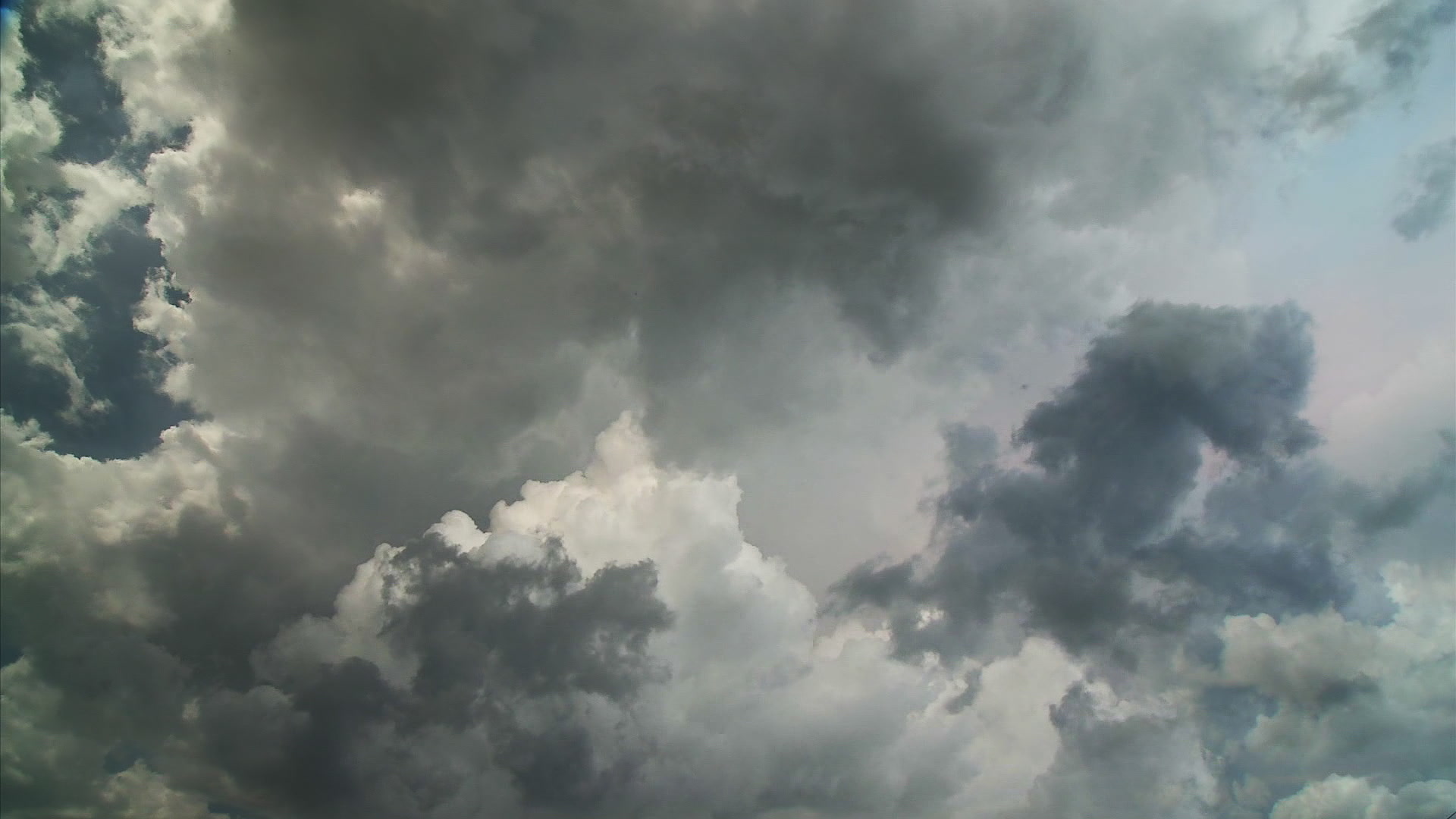 Beautiful sky, bright storm clouds converge - Super 35mm film to HD 1080.