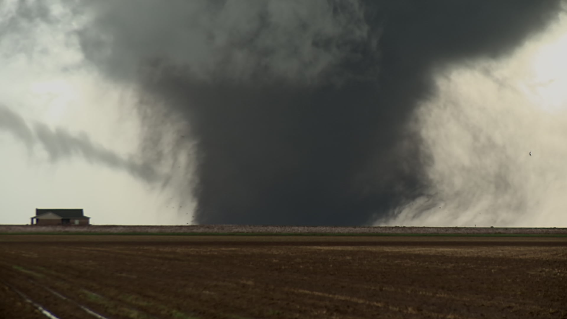 Large, wedge shaped tornado with big lightning strike - HD 1080.